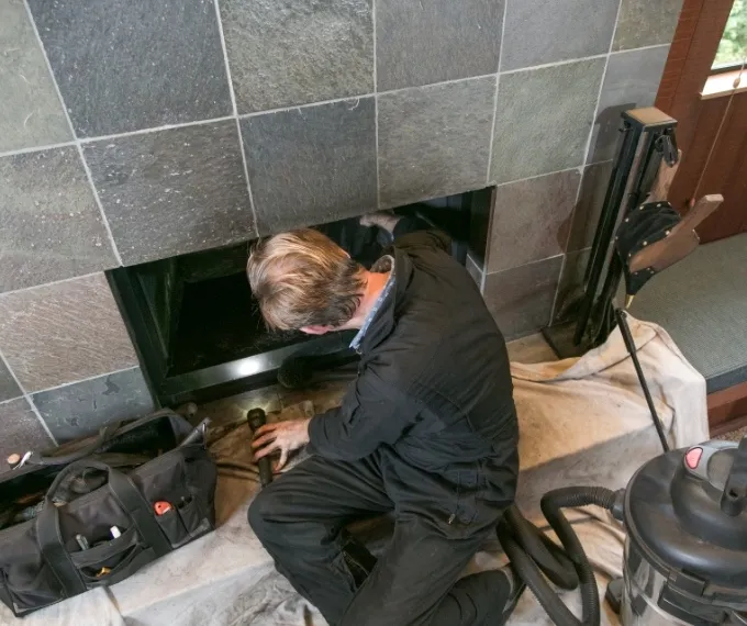 Professional chimney repair technician working in New Jersey