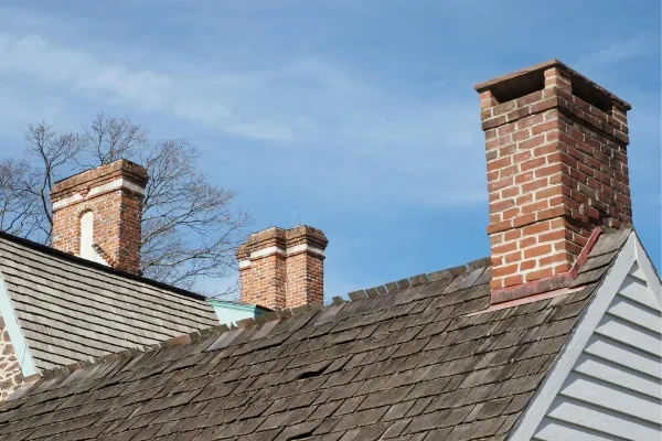 Chimneys on historic homes in New Jersey under clear blue sky