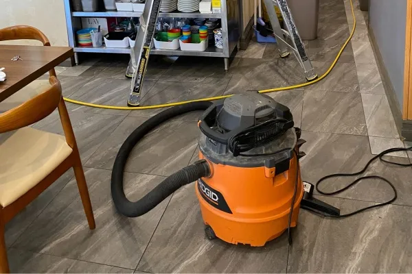 Clogged dryer vent repair process in a New Jersey residential setting demonstrating the use of vacuums and tools Clogged dryer vent repair process in a New Jersey residential setting demonstrating the use of vacuums and tools