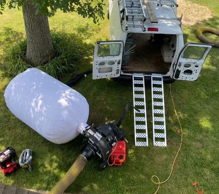 Professional HVAC system cleaning service in New Jersey with specialized equipment in action at a residential location