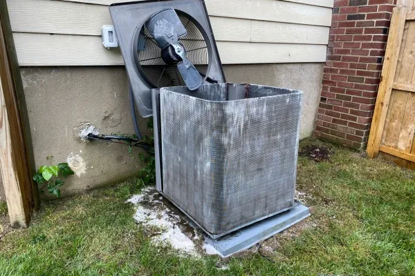 Cleaning a blower motor unit outside a home in New Jersey to ensure optimal air circulation and system efficiency Cleaning a blower motor unit outside a home in New Jersey to ensure optimal air circulation and system efficiency